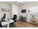 Bright home office featuring wood floors, a modern desk, and a comfortable black chair at 215 Cypress Plantation Rd, Moncks Corner, SC 29461