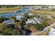 Scenic aerial view featuring charming homes nestled among lush trees, overlooking a picturesque waterfront community at 222 Haddrell St, Mount Pleasant, SC 29464