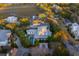Aerial view of a gated waterfront community with mature trees and private in-ground pools at 222 Haddrell St, Mount Pleasant, SC 29464