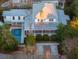 Aerial view of house with pool, screened porch, brick chimney, and manicured landscaping at 222 Haddrell St, Mount Pleasant, SC 29464