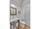 Charming powder room featuring shiplap walls, stylish fixtures, and a classic design at 222 Haddrell St, Mount Pleasant, SC 29464
