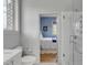 Bright bathroom with a doorway to a blue bedroom, a toilet, and a shower at 222 Haddrell St, Mount Pleasant, SC 29464