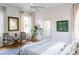 Bright bedroom featuring large windows, hardwood floors, and stylish accents at 222 Haddrell St, Mount Pleasant, SC 29464