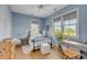 Bedroom with blue walls, three windows, a desk and an iron bed at 222 Haddrell St, Mount Pleasant, SC 29464