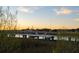 Scenic view of a dock at sunset, offering a tranquil and inviting outdoor space at 222 Haddrell St, Mount Pleasant, SC 29464