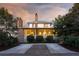 Charming Southern-style home with a brick driveway and a screened-in front porch at 222 Haddrell St, Mount Pleasant, SC 29464
