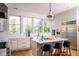 Modern kitchen with white cabinets, marble countertops, stainless steel appliances, and counter seating at 222 Haddrell St, Mount Pleasant, SC 29464