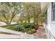 Beautiful brick pathway with well-manicured landscaping and mature trees enhancing the property's curb appeal at 222 Haddrell St, Mount Pleasant, SC 29464