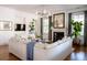 Inviting living room features a large sectional sofa, fireplace, hardwood floors, and shiplap walls at 222 Haddrell St, Mount Pleasant, SC 29464