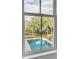 A view of the in-ground pool from the window at 222 Haddrell St, Mount Pleasant, SC 29464
