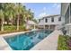 Inviting backyard oasis featuring a sparkling pool, cabana, and lush landscaping at 222 Haddrell St, Mount Pleasant, SC 29464