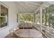 Charming outdoor screened porch with vaulted ceilings and wooded view at 222 Haddrell St, Mount Pleasant, SC 29464