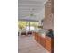 Relaxing screened porch with outdoor kitchen, fireplace, and comfortable seating at 222 Haddrell St, Mount Pleasant, SC 29464