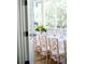 Open screened porch with long table for outdoor dining, and view of trees at 222 Haddrell St, Mount Pleasant, SC 29464
