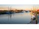 Scenic waterfront view featuring boats docked at sunset at 222 Haddrell St, Mount Pleasant, SC 29464