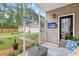 Relaxing porch with outdoor furnishings, offering serene backyard views at 234 Cameron St, Summerville, SC 29486