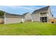 Spacious backyard featuring a well-maintained lawn and a detached garage at 234 Cameron St, Summerville, SC 29486
