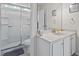 Bathroom featuring a shower with sliding doors, white vanity, and granite countertop at 234 Cameron St, Summerville, SC 29486