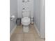 Small but efficient half bath features tiled floor and convenient storage at 234 Cameron St, Summerville, SC 29486