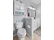 A cozy bathroom features a toilet and vanity with nautical-themed decor at 234 Cameron St, Summerville, SC 29486