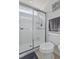 Bathroom showcasing a glass-enclosed shower, tile flooring, and modern toilet at 234 Cameron St, Summerville, SC 29486