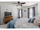Bright bedroom featuring a ceiling fan, carpet, and closet with white double doors at 234 Cameron St, Summerville, SC 29486