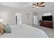 A bright bedroom features a ceiling fan and a comfortable bed with decorative pillows at 234 Cameron St, Summerville, SC 29486