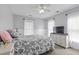 Carpeted bedroom with a ceiling fan, large bed, and natural light at 234 Cameron St, Summerville, SC 29486