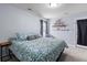 Cozy bedroom displaying comfortable bed, neutral walls, and shelf with decorative items at 234 Cameron St, Summerville, SC 29486