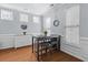 Cozy dining room with natural light, featuring a table with upholstered stools and neutral decor at 234 Cameron St, Summerville, SC 29486