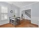 Bright dining room features natural light, light grey walls and trim, and wood floors at 234 Cameron St, Summerville, SC 29486