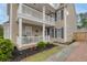 Charming home exterior with a cozy front porch, manicured landscaping, and a welcoming entrance at 234 Cameron St, Summerville, SC 29486