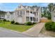 Charming two-story home boasts a double porch, well-maintained landscaping, and a private driveway and garage at 234 Cameron St, Summerville, SC 29486