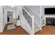 Inviting foyer with hardwood floors, staircase, and decorative accents offers a warm welcome to the home at 234 Cameron St, Summerville, SC 29486