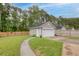 Detached garage with matching siding, enhancing the home's curb appeal at 234 Cameron St, Summerville, SC 29486