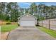 Detached garage with a clean white door, blending seamlessly with the property's design at 234 Cameron St, Summerville, SC 29486