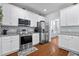 Well-lit kitchen equipped with stainless steel appliances and ample storage at 234 Cameron St, Summerville, SC 29486