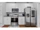 Modern kitchen features stainless steel appliances and white cabinets at 234 Cameron St, Summerville, SC 29486