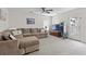 A bright living room has comfortable seating, a ceiling fan and backyard access at 234 Cameron St, Summerville, SC 29486