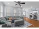 Spacious living room offers hardwood floors, neutral walls, and an open concept layout to dining area at 234 Cameron St, Summerville, SC 29486