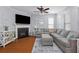 Inviting living room featuring a fireplace, large sectional sofa, and plenty of natural light at 234 Cameron St, Summerville, SC 29486
