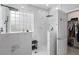 A tiled glass shower boasts a rain shower head and adjacent walk-in closet at 234 Cameron St, Summerville, SC 29486