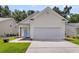 Well-maintained single-Gathering home featuring a bright blue door, two-car garage, and landscaped front at 252 Island Green Rd, Goose Creek, SC 29445