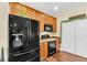Well-equipped kitchen featuring stainless steel appliances, ample wood cabinetry, and convenient oven at 252 Island Green Rd, Goose Creek, SC 29445