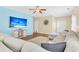 Bright living room featuring hardwood floors, comfortable seating, and a flat-screen television at 252 Island Green Rd, Goose Creek, SC 29445