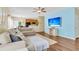 Open-concept living room featuring a comfortable sectional sofa, hardwood floors, and a modern TV at 252 Island Green Rd, Goose Creek, SC 29445