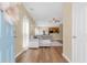 Inviting living room featuring hardwood floors and a comfortable sectional sofa, open to the kitchen at 252 Island Green Rd, Goose Creek, SC 29445