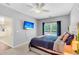 Comfortable main bedroom featuring a TV, a ceiling fan, and a bright window for natural light at 252 Island Green Rd, Goose Creek, SC 29445