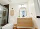 Bathroom featuring a wood vanity, modern mirror, and tiled shower with glass doors at 27 Fitzroy Dr, Charleston, SC 29414