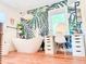 Modern bathroom with freestanding tub, vanity, and tropical-themed wallpaper at 27 Fitzroy Dr, Charleston, SC 29414
